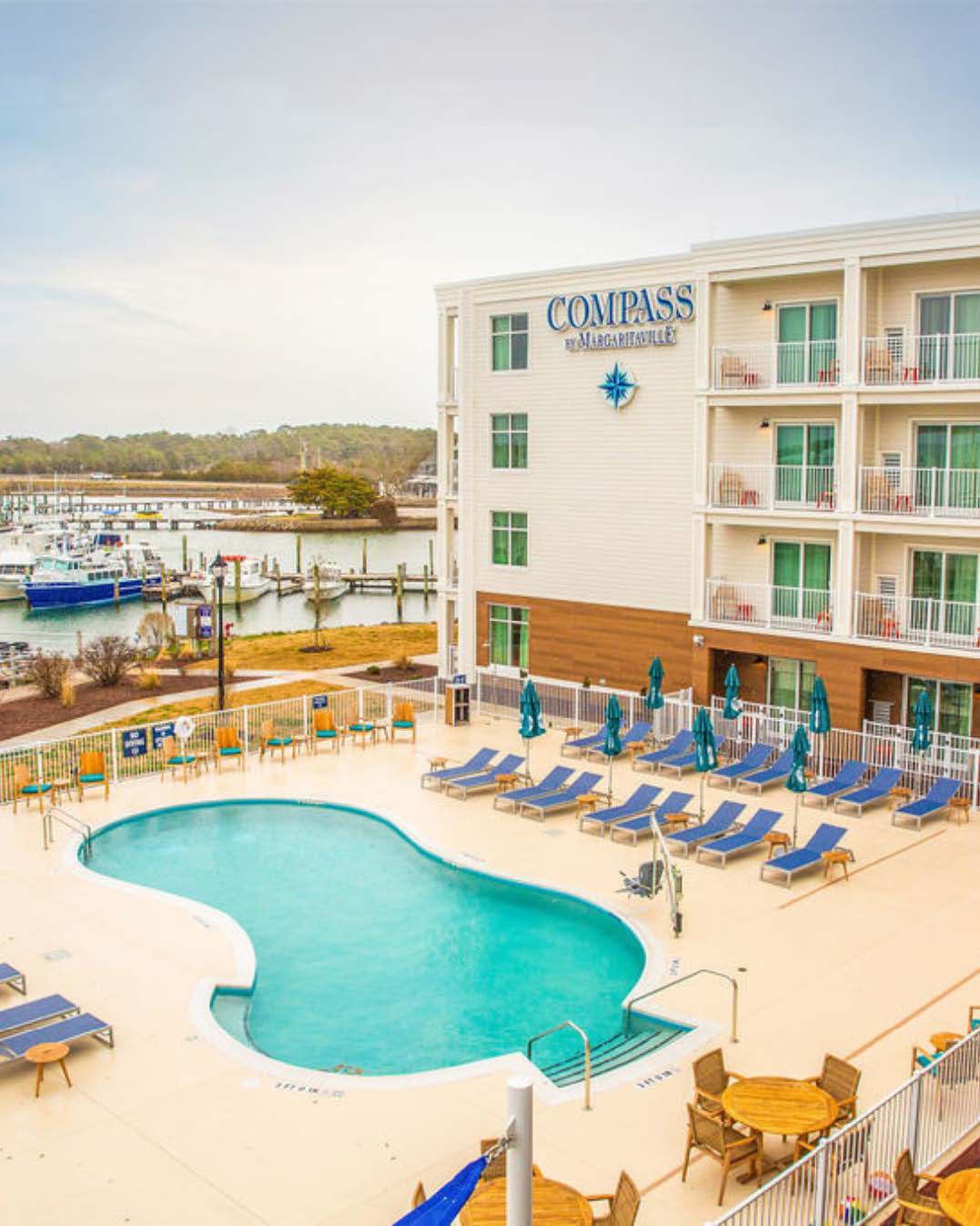An outdoor pool at a hotel on a sunny day